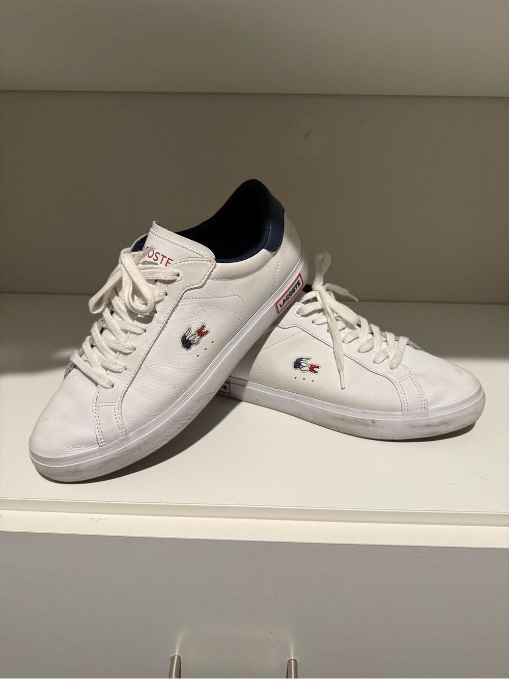 Lacoste White Leather Sneakers with Navy Heel and Red Accents
